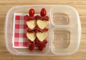 Close up of Valentine's Day Bento Cheese Heart, salami, cherry tomato kabob