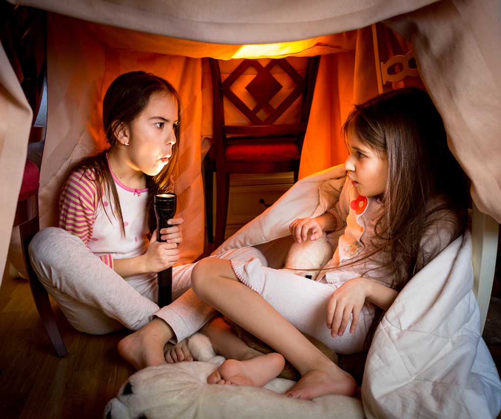 Little Passports Blog Spooky Stories Girls under Blanket Fort 