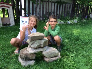 Little Passports Exploring Canada Blog Girl and Boy Building Inukshuks