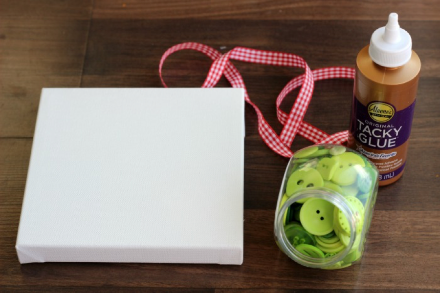 Supplies to make an evergreen button wreath with Little Passports