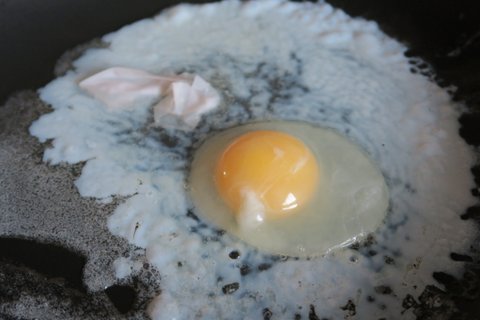 Naked egg in pan
