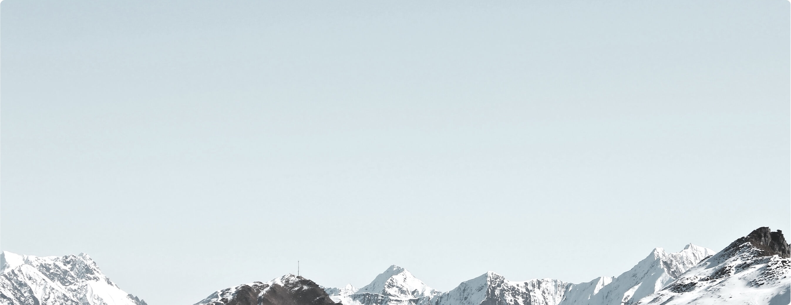 Blue sky and mountains covered with snow