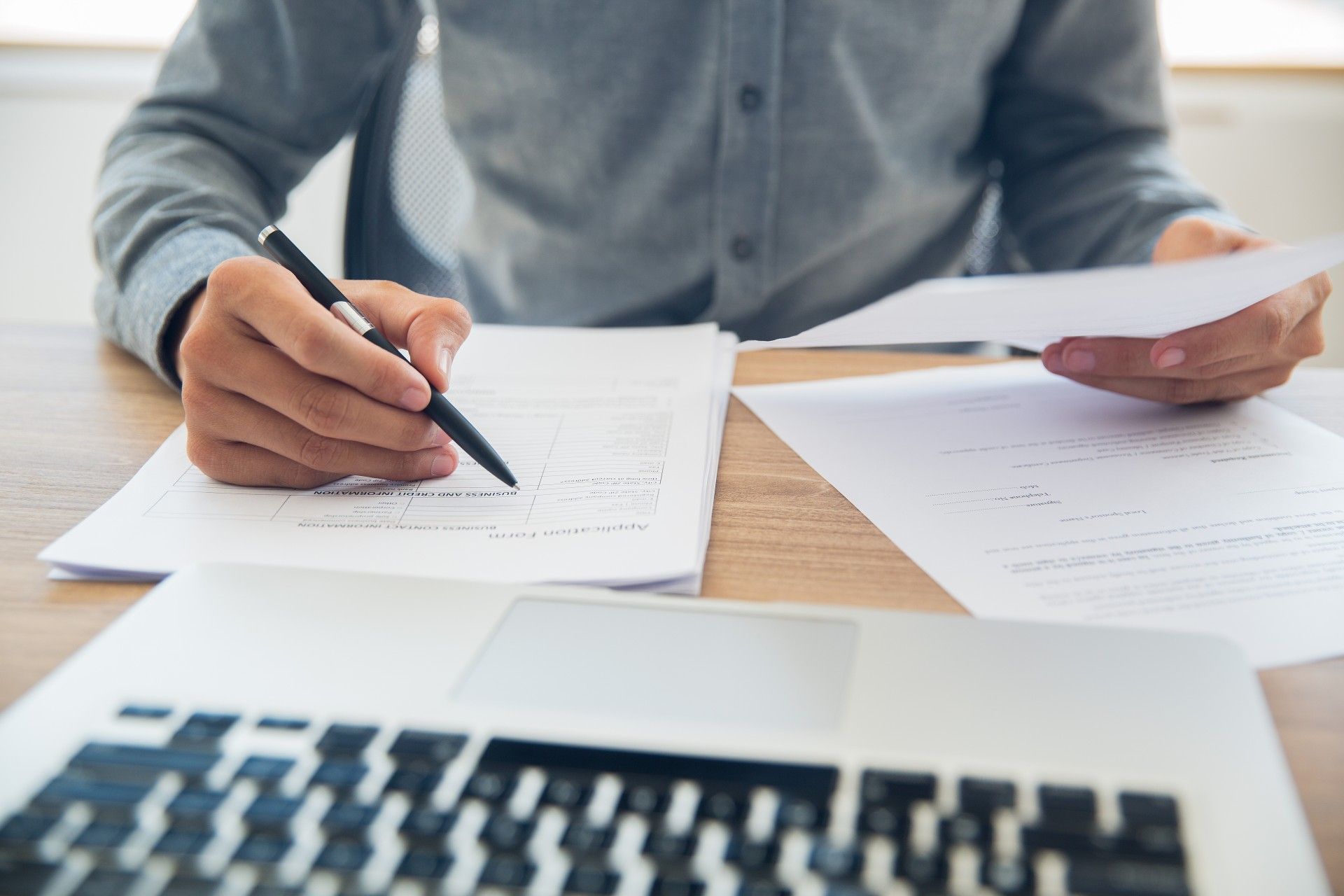 businessman-checking-documents-table.jpeg