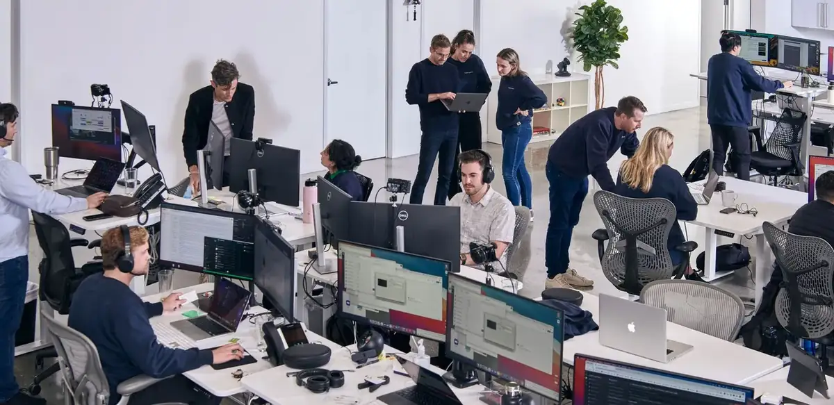 The LiveControl office with teams collaborating across open workspaces