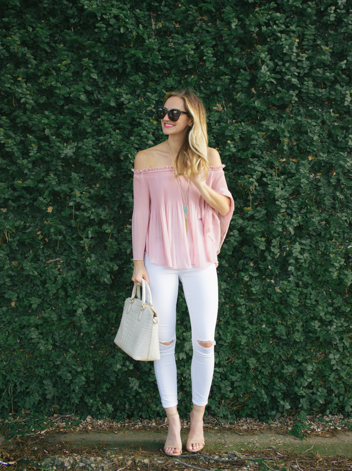 Spring weekend cafe outfit - pink off shoulder top, white jeans, studded  sandals, an…