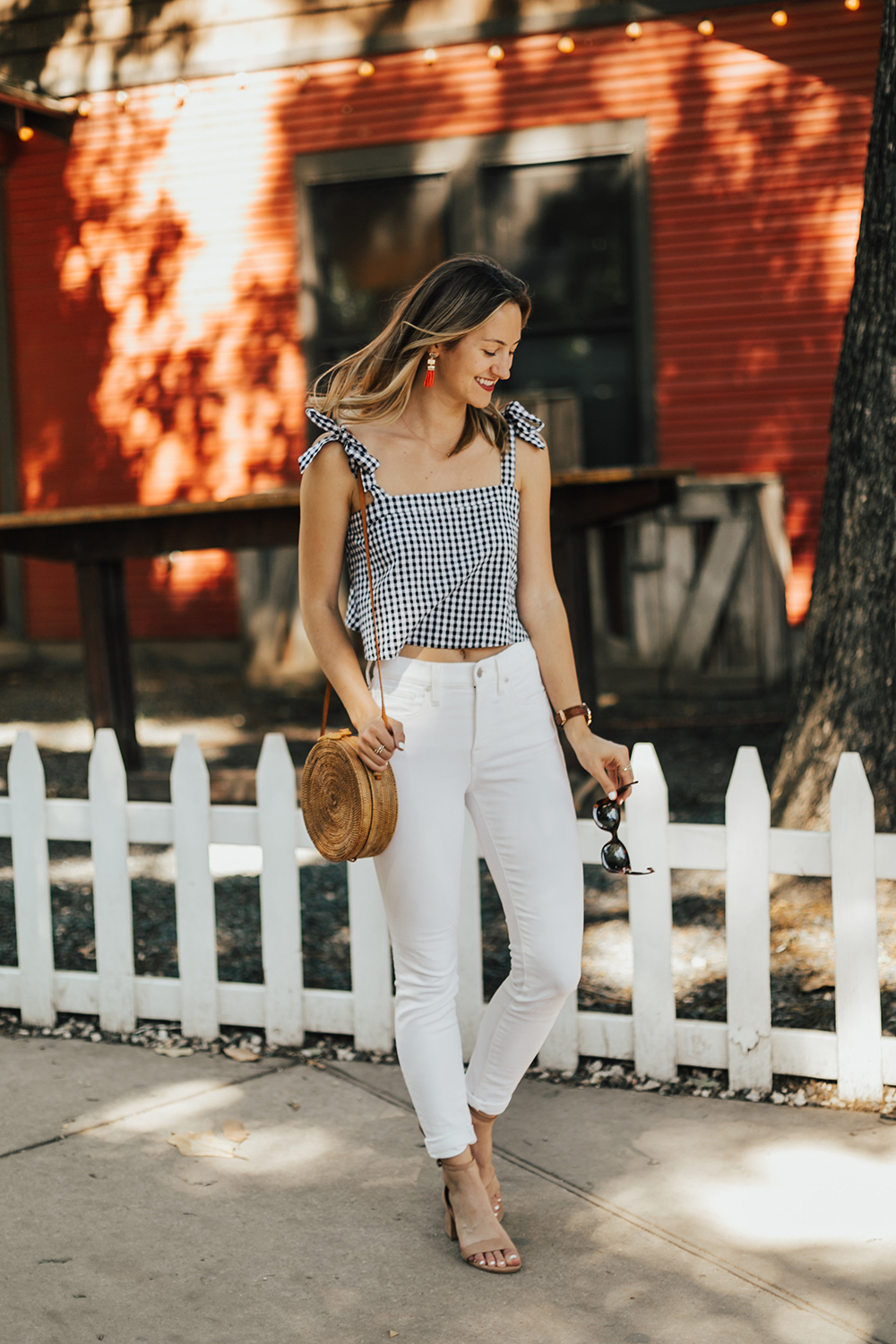 https://storage.googleapis.com/livvyland/2017/05/livvyland-blog-olivia-watson-gingham-tie-sleeve-crop-top-basket-weave-round-wicker-handbag-summer-outfit-austin-texas-fashion-blogger-2.jpg