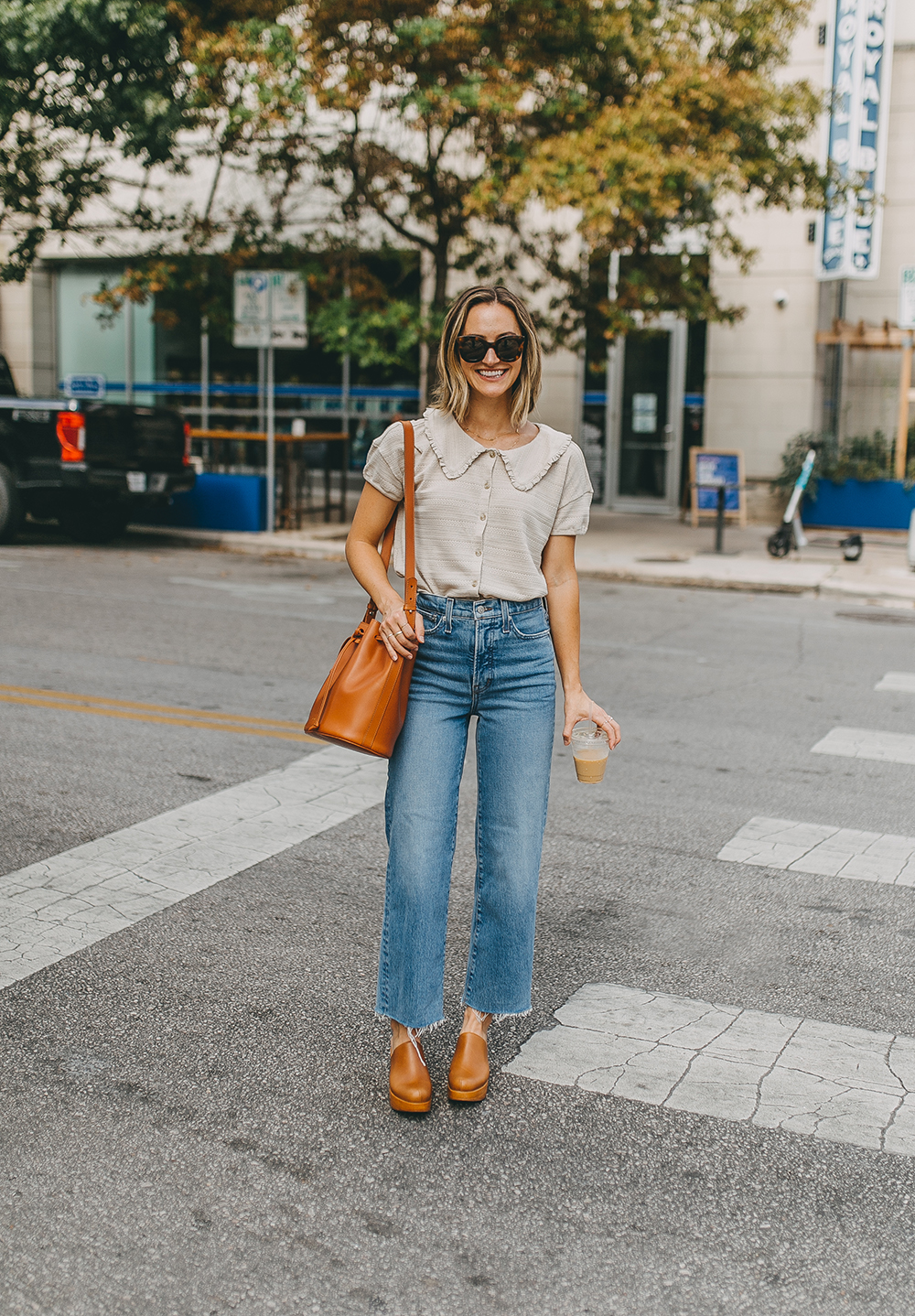 https://storage.googleapis.com/livvyland/2022/09/livvyland-blog-olivia-watson-fall-outfit-idea-ava-platform-clog-madewell-caitlin-wide-leg-jeans-collared-top-sezane-farrow-bag-3.jpg