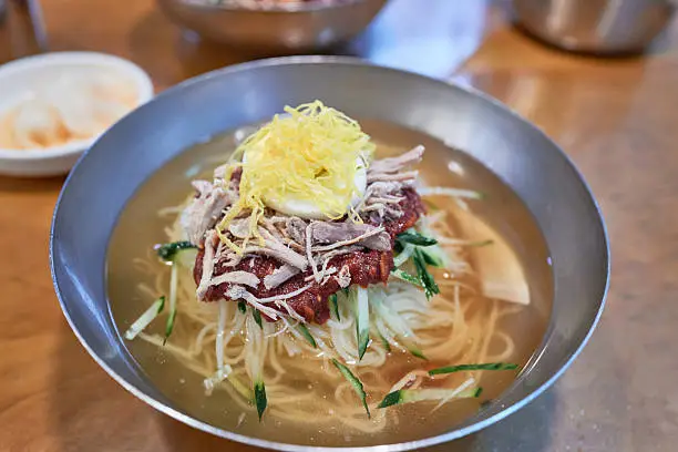 A close-up of Milmyeon, Korean cold wheat noodles | Lokafy