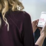 Blond woman with with white iphone