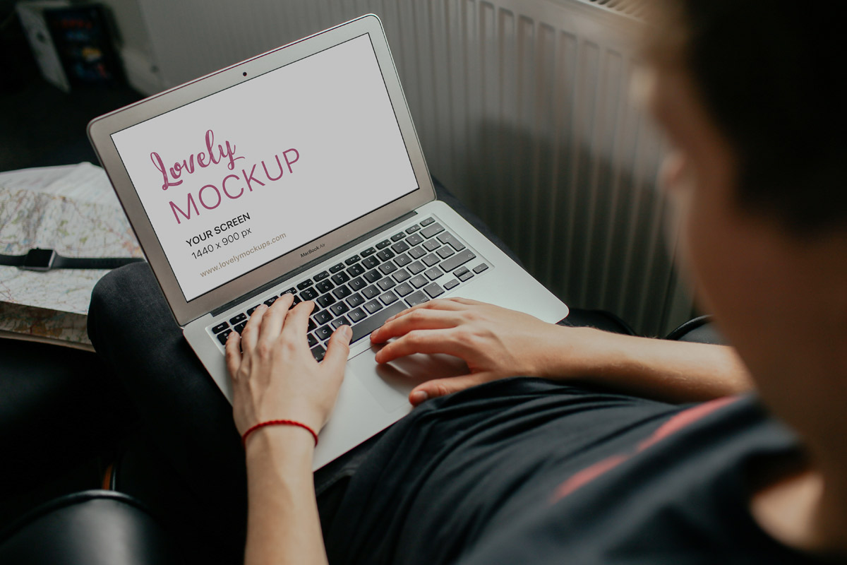 young-man-working-on-his-macbook-air-lovely-mockups