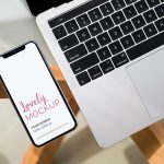 iPhone X and Macbook on Glass Table