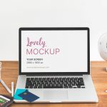 Macbook Mockup With Credit Cards on Table