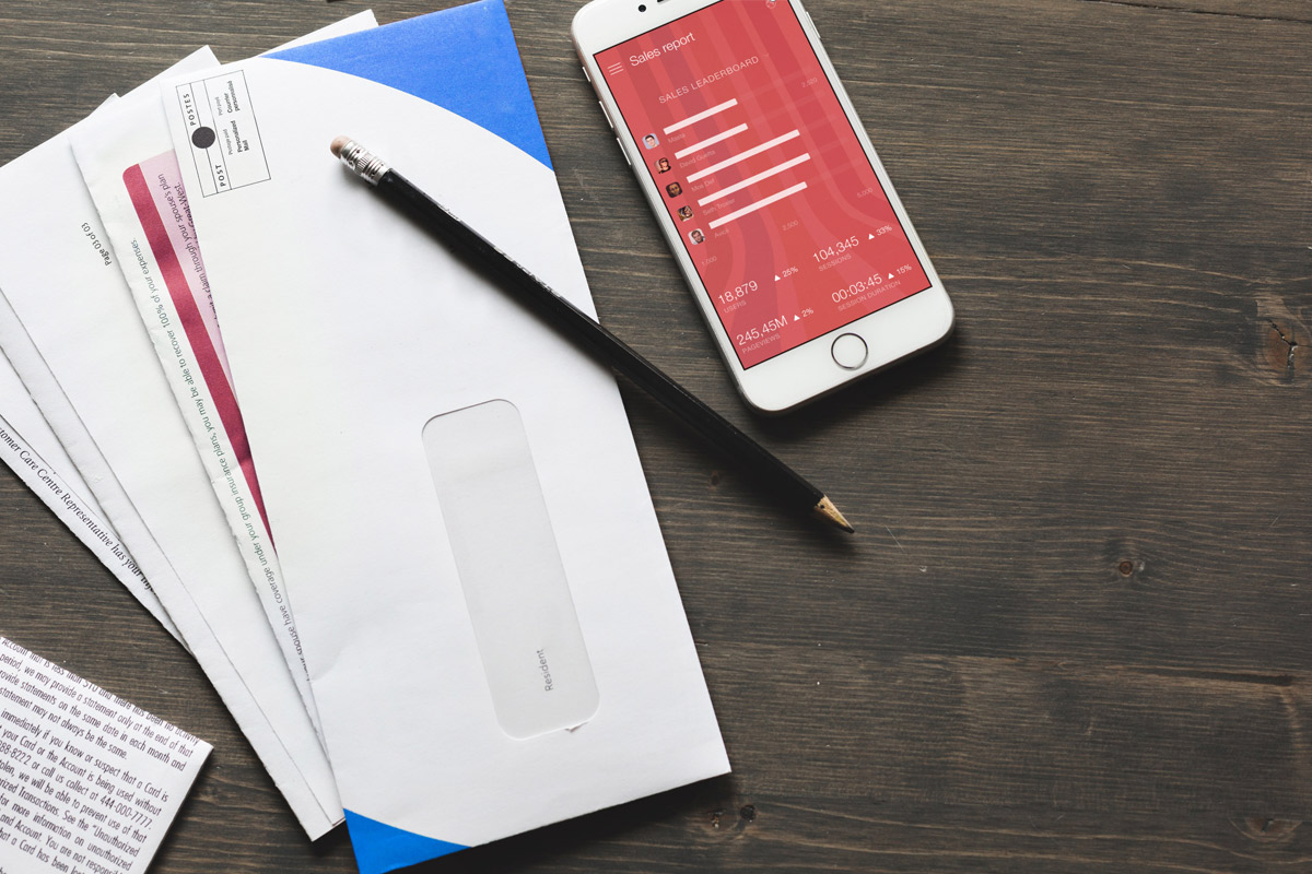 Download iPhone Mockup With Bills and Receipts on Table - Lovely Mockups