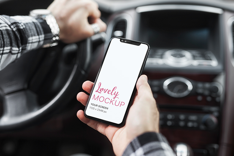 Download Mockup of a Man Holding an iPhone 11 in His Car - Lovely ...