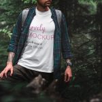 Mockup of a Man Wearing a Tee in a Forest Scenery Featured