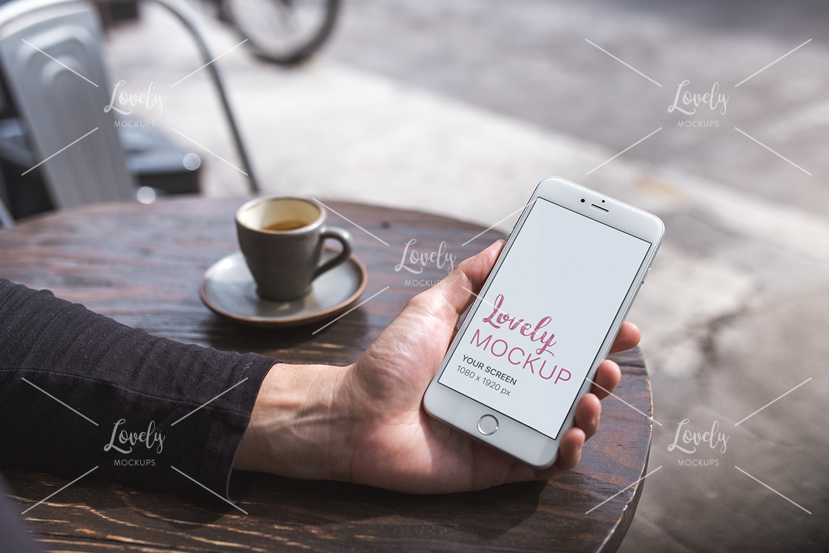 Download Mockup Of An Iphone Being Held At A Coffee Shop Lovely Mockups