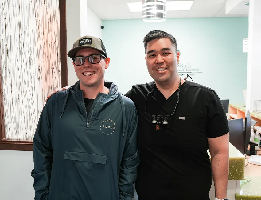 Happy patient after getting dental crowns at Carlsbad Dental Care