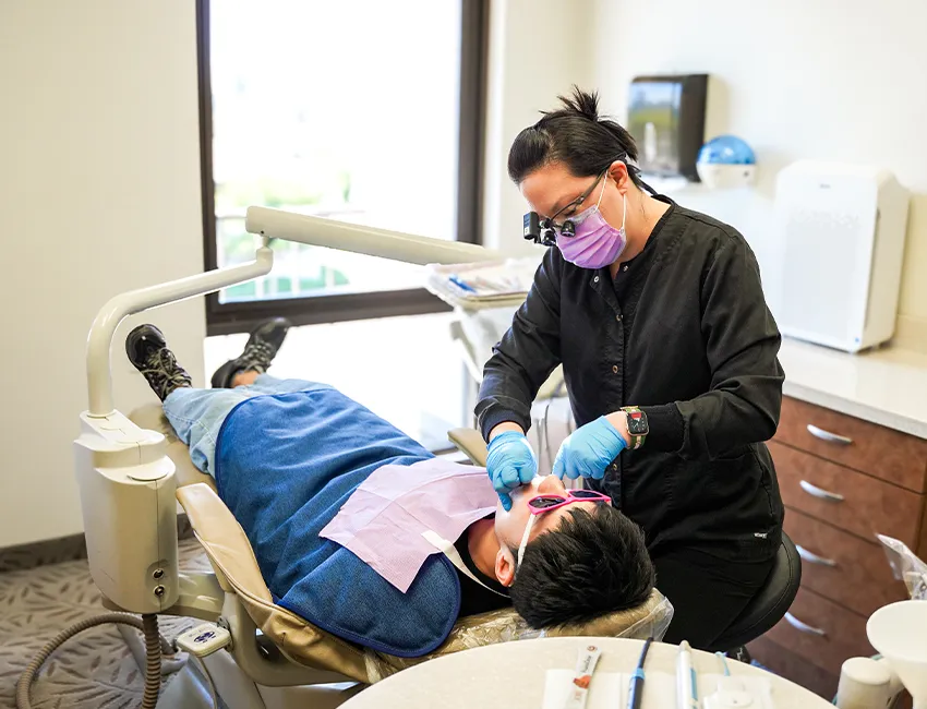 Patient getting dental checkup and teeth cleaning in Fullerton, CA