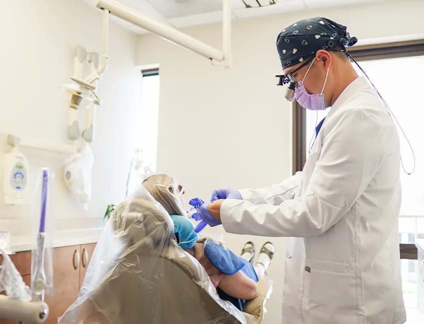 Patient and dentist looking at dental exam results