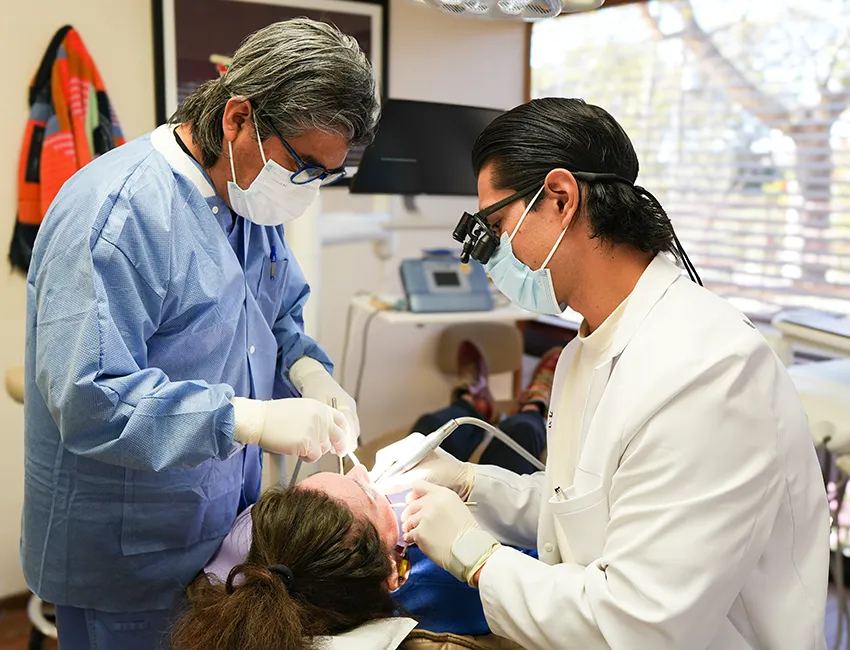 Female patient setting on dental chair with tooth pain at Malibu Dentistry