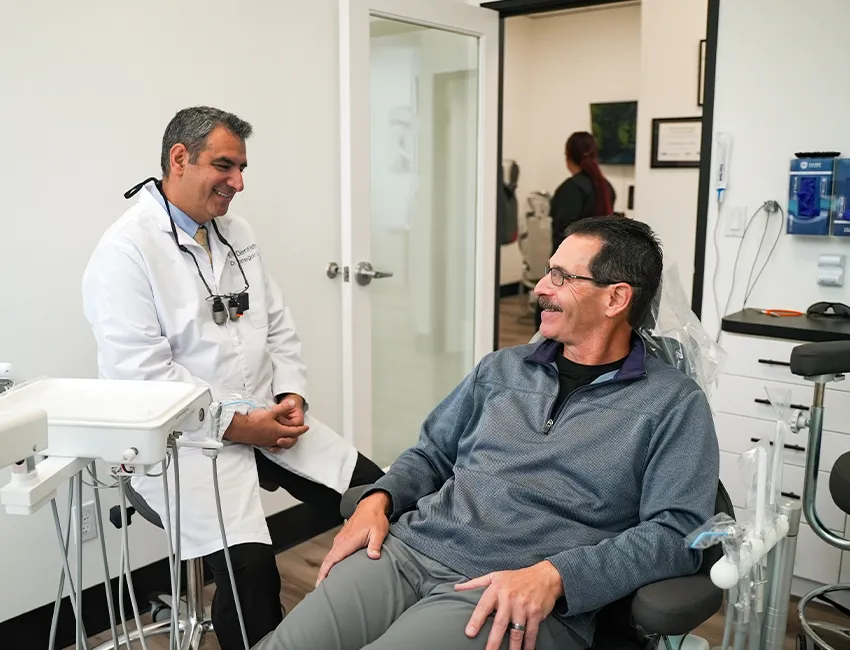 Happy patient after getting dental checkup at Elite Dentistry