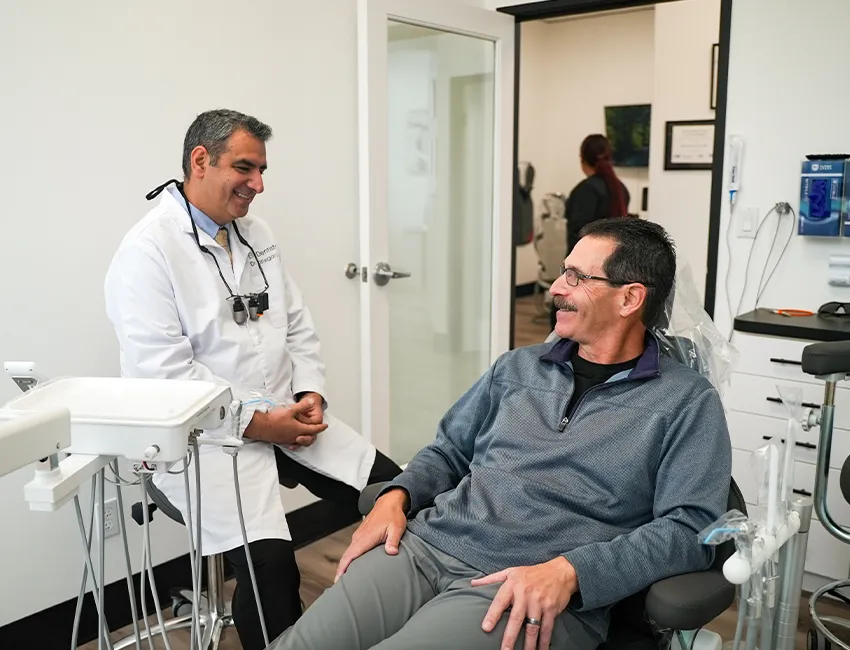Happy patient after emergency dentist treatment at Elite Dentistry
