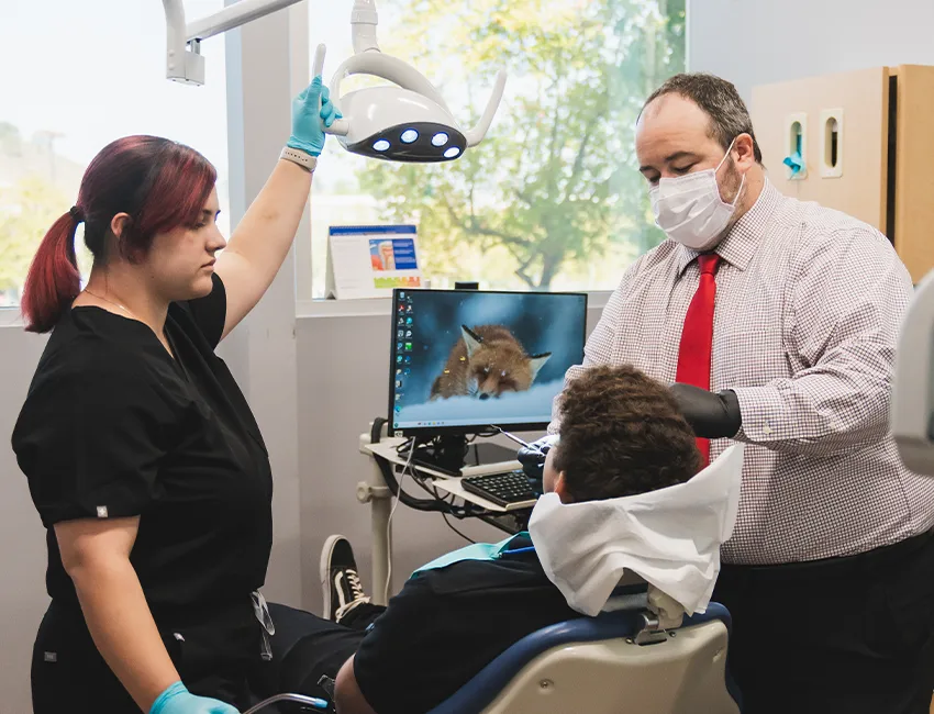 Patient getting his teeth check for cavities at Valencia Aesthetic Dentistry