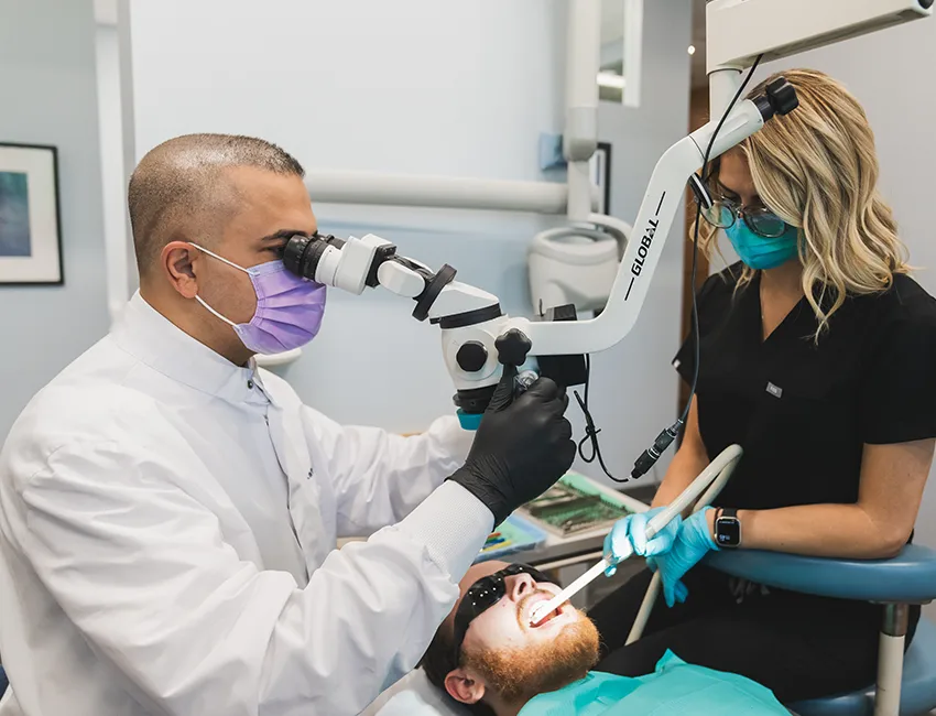 Endodontist working on patient in Valencia, CA