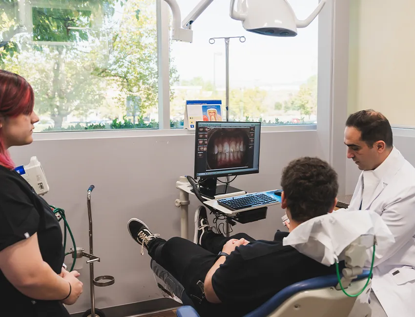 Dentist looking at X-Ray