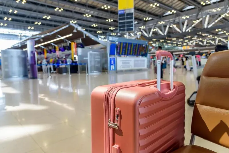 El Prat terminal with luggage — long layover in Barcelona