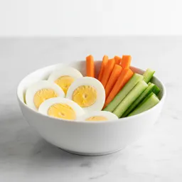 Hard-boiled Eggs With Raw Carrot And Cucumber Sticks