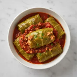 Stuffed Cabbage Leaves With Lentils And Brown Rice In Tomato Sauce