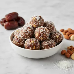 Sweet Balls With Dates, Nuts, And Coconut Flakes