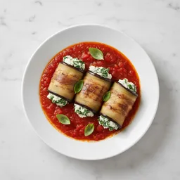 Eggplant Rolls With Cottage Cheese And Spinach In Tomato Sauce