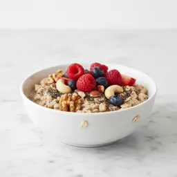 Rolled Oats Soaked With Chia Seeds, Nuts, Unsweetened Milk, And Berries