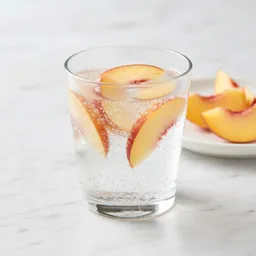 Carbonated Water With Fresh Peach Slices (no Added Sugars)