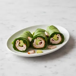 Sliced Turkey Breast And Avocado Wrapped In Lettuce Leaves