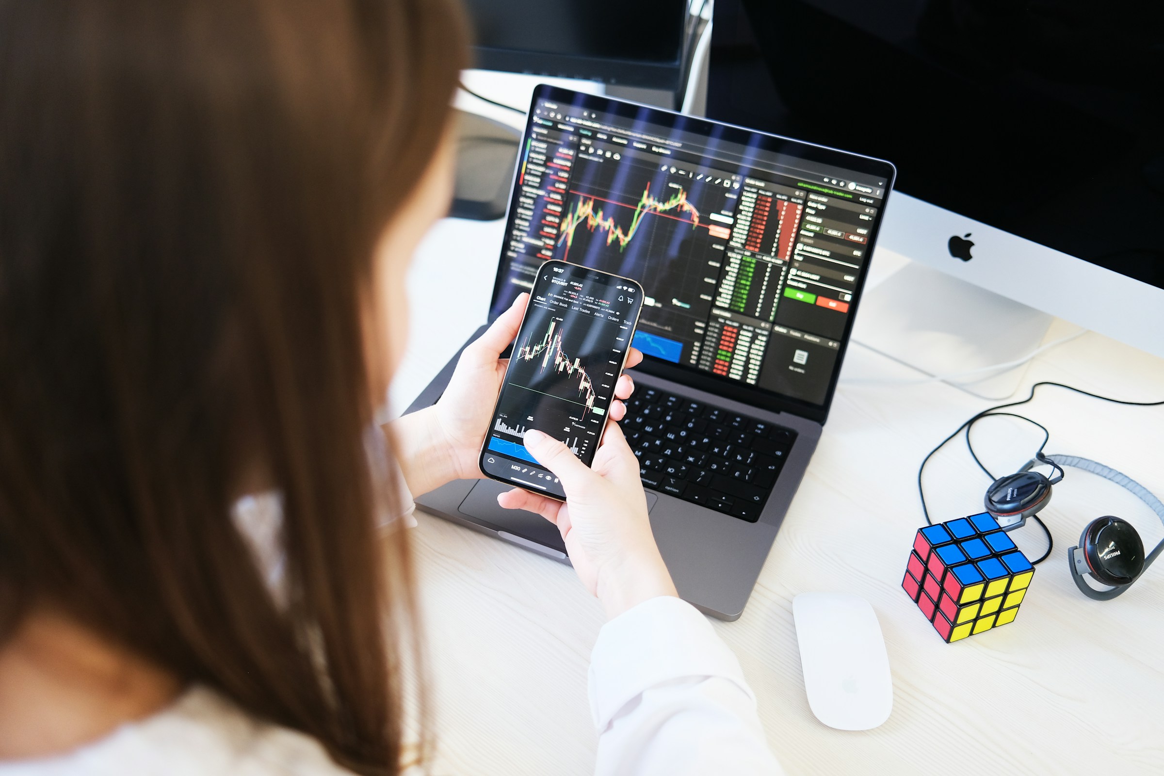 Woman Looking at Trading Charts - StockCharts vs. TradingView