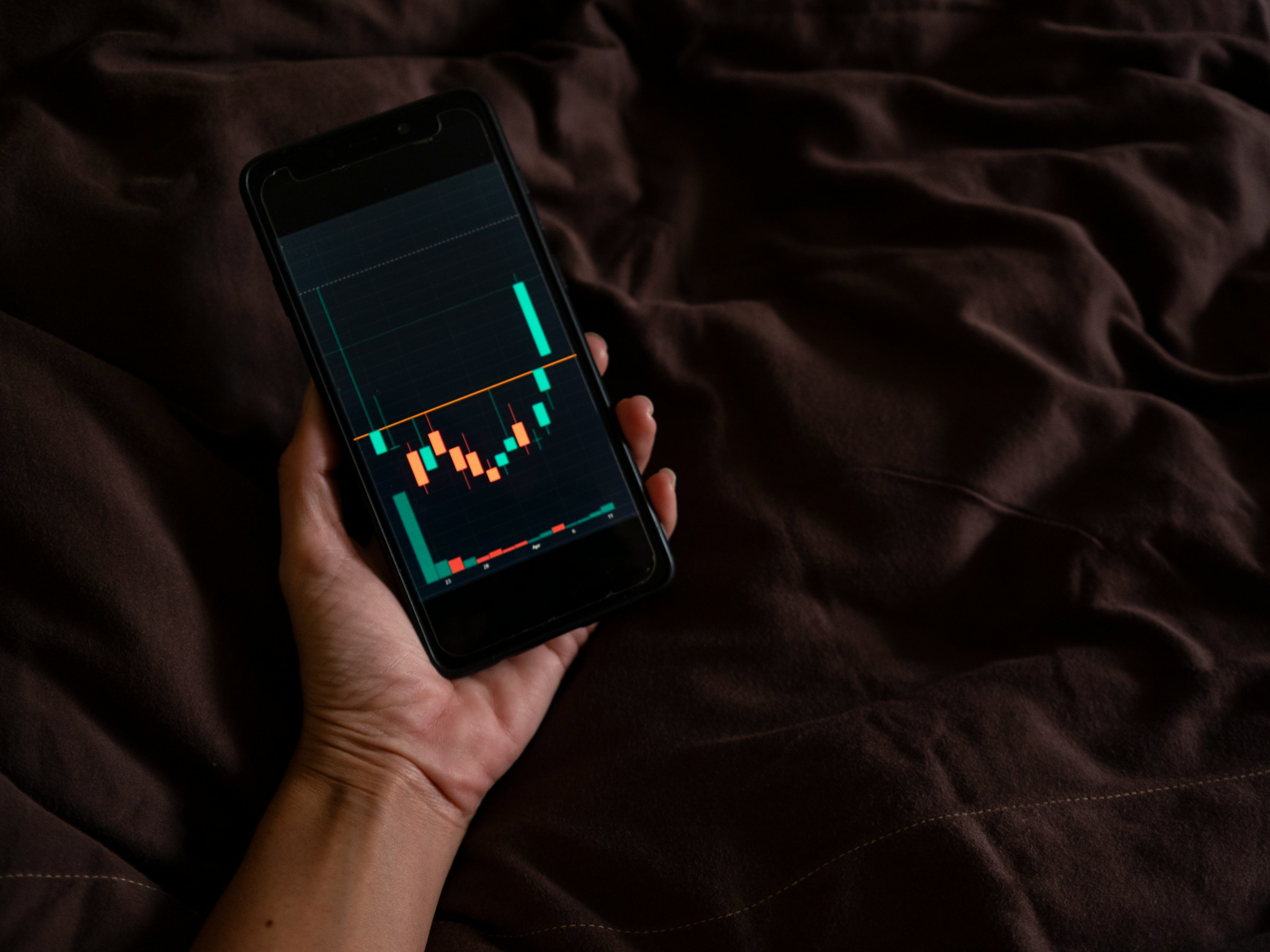 man looking at trade candles - bitcoin bull run