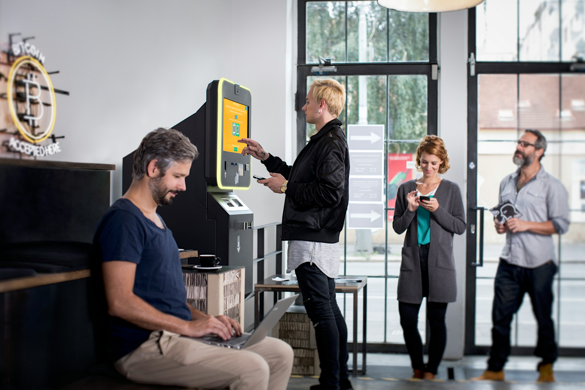 person at a shop - How to Use a Bitcoin ATM