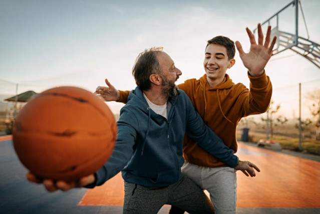 Invite him to a pick-up basketball game.