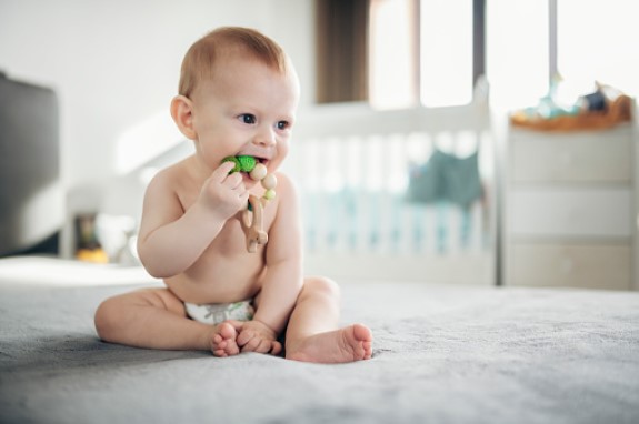 Allow your baby to explore toys using their mouth.