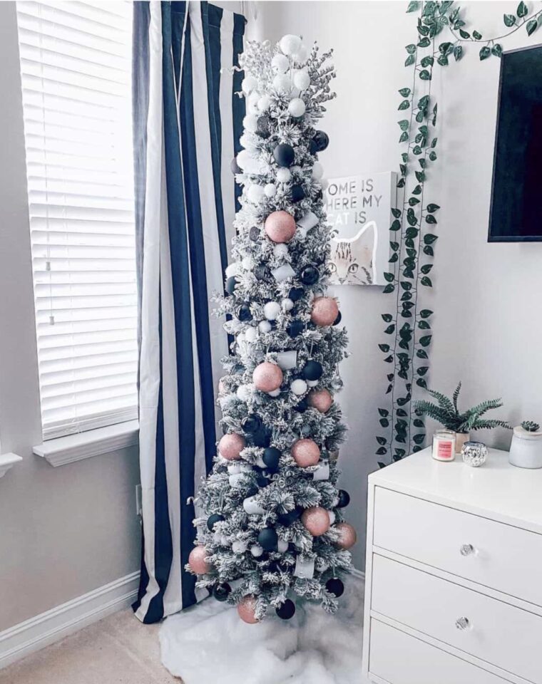 Bedroom with thin pink black pencil tree 