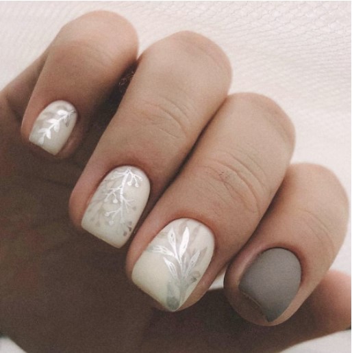 White Christmas nails with silver leaf