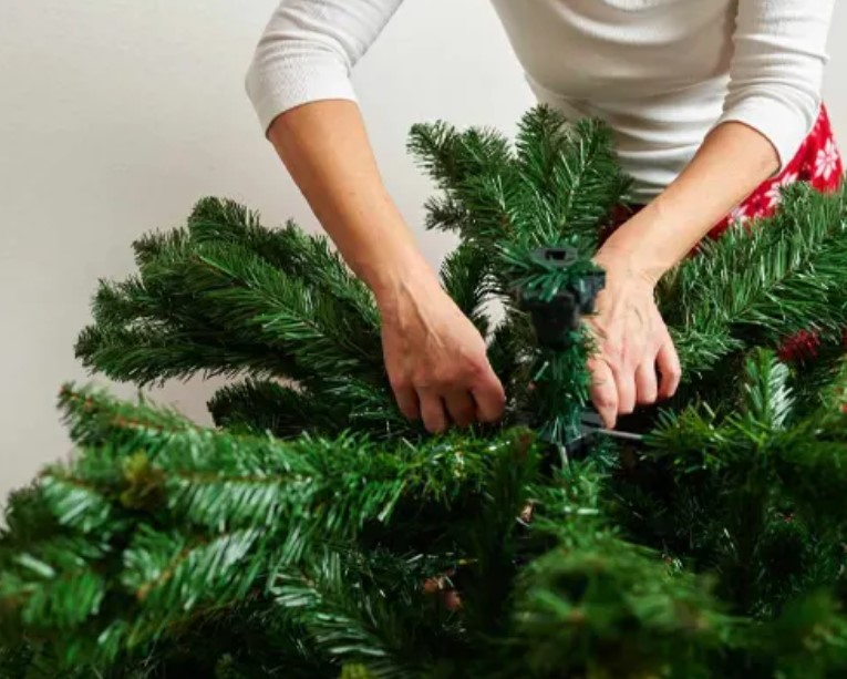 Fluff your tree and attach a bow