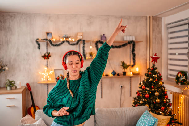 Listen to a Christmas playlist and dance