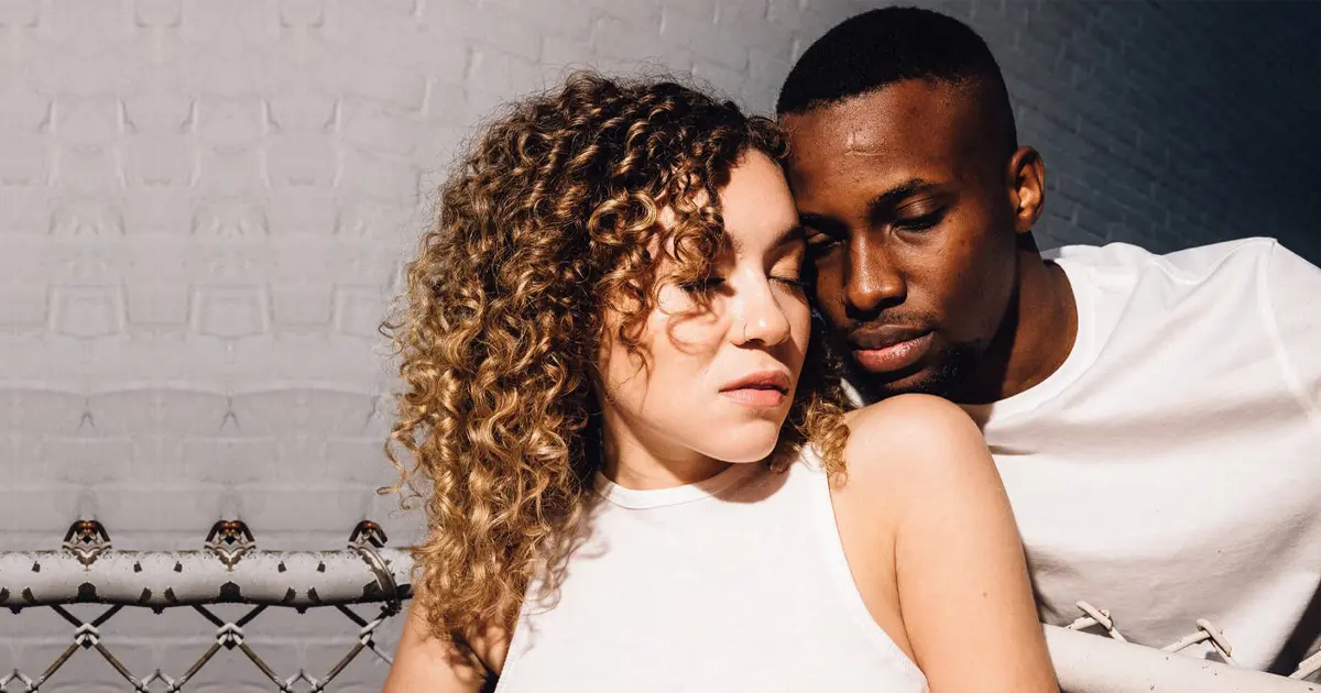 A photo of a couple engaged in interracial dating