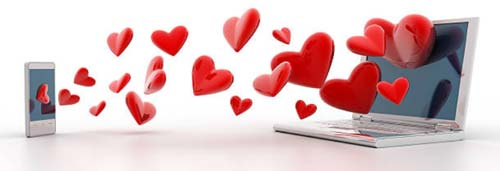 Gadgets with hearts in between representing online dating.