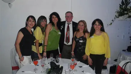 A smiling client with the beautiful, Colombian brides