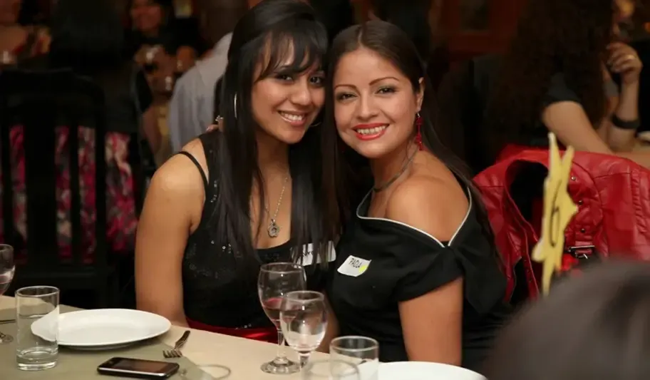 Mexican women smiling at the camera.